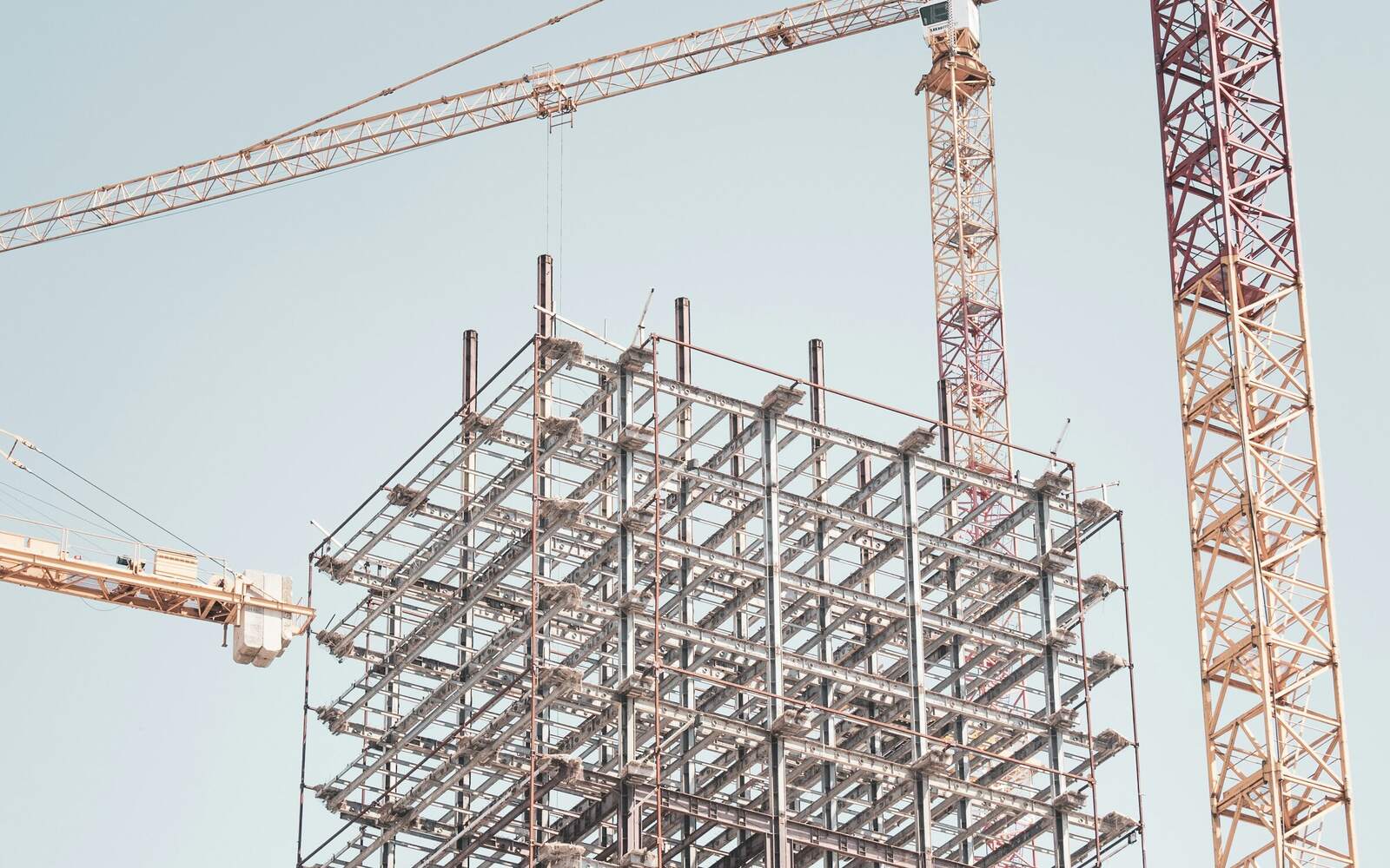 Construction site with tower crane and steel structure